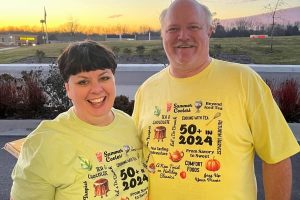 Marlys & Alan showing off our library tour shirts.
